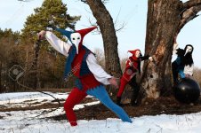 7548756-Troupe-of-medieval-actors-in-suits-of-ancient-clowns-entertaining-people--Stock-Photo.jpg